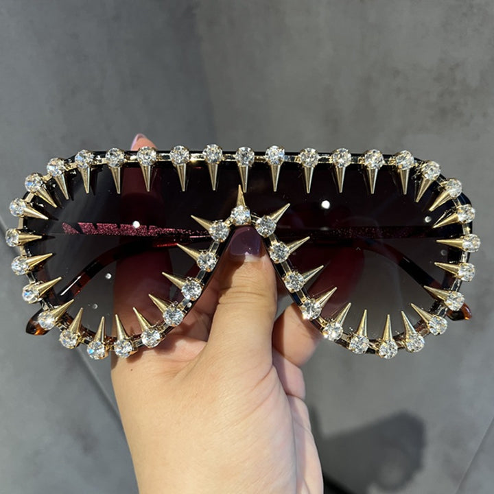 Ladies extravagantly designed cat-eye sunglasses with glitter accents Stornfield