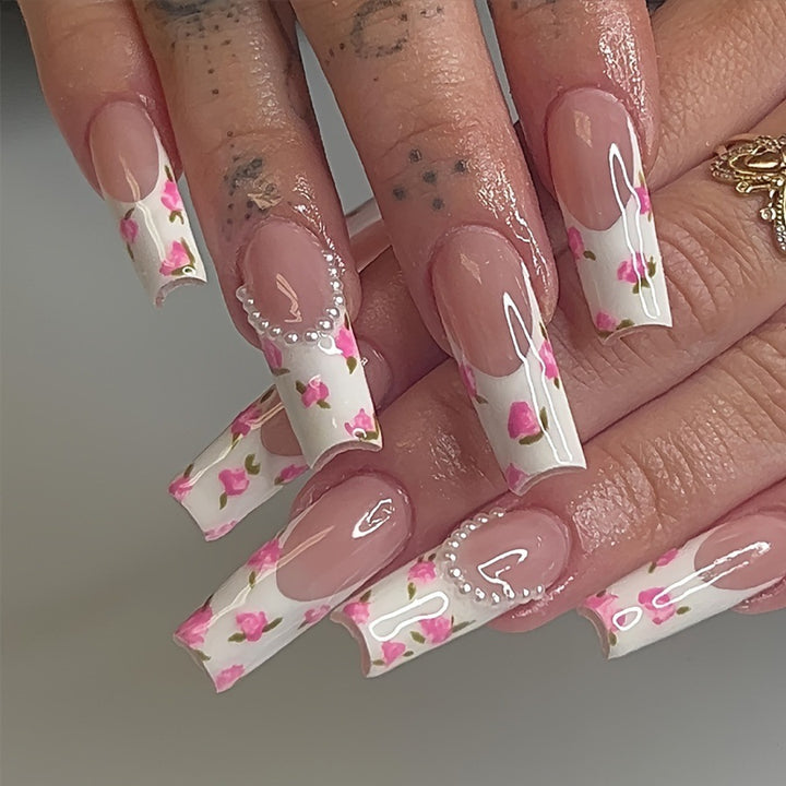 Artificial nail set with floral designs and elegant decorations Stornfield