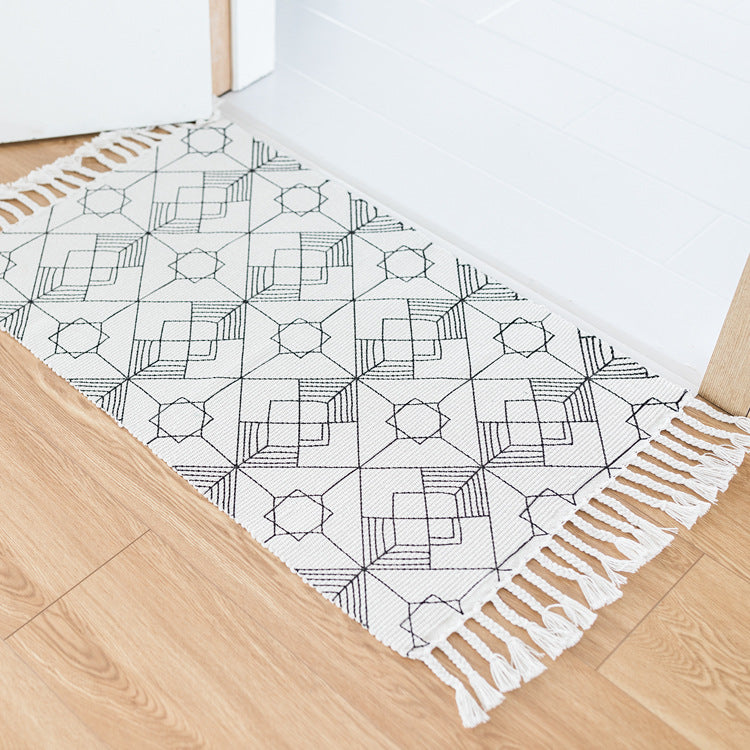 Flat-woven entrance runner made of cotton blend with geometric tile pattern and fringes Stornfield