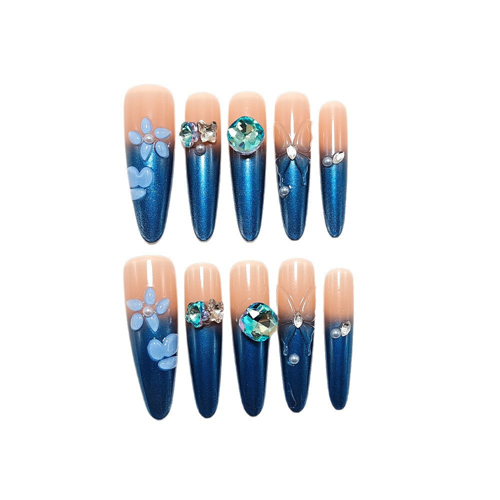 Artificial nails in elegant design with artistic decorations and glitter accents Stornfield