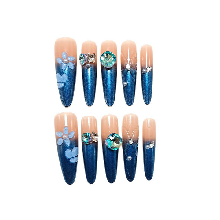 Artificial nails in elegant design with artistic decorations and glitter accents Stornfield