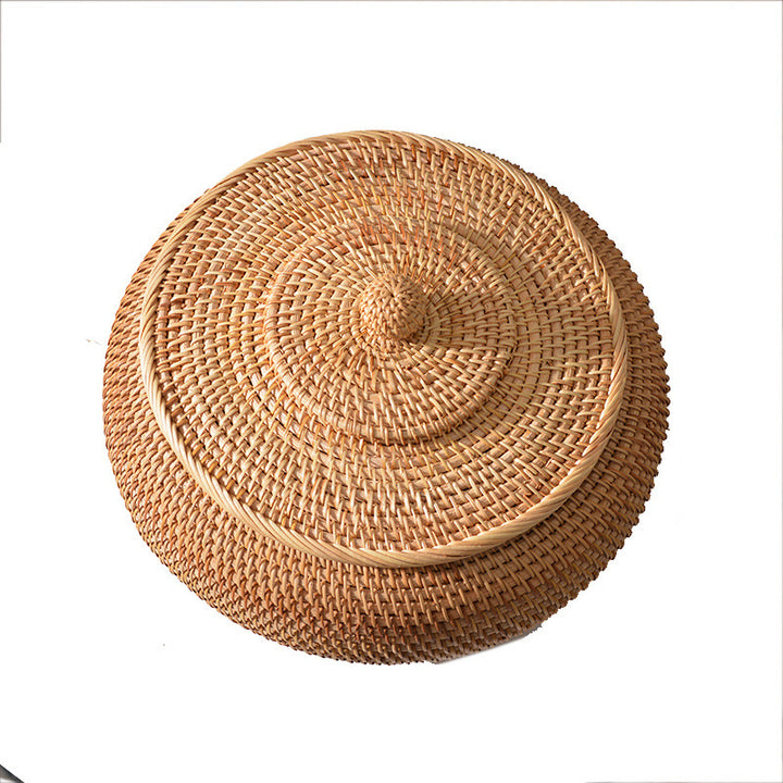Women's round storage basket made of woven natural material Stornfield
