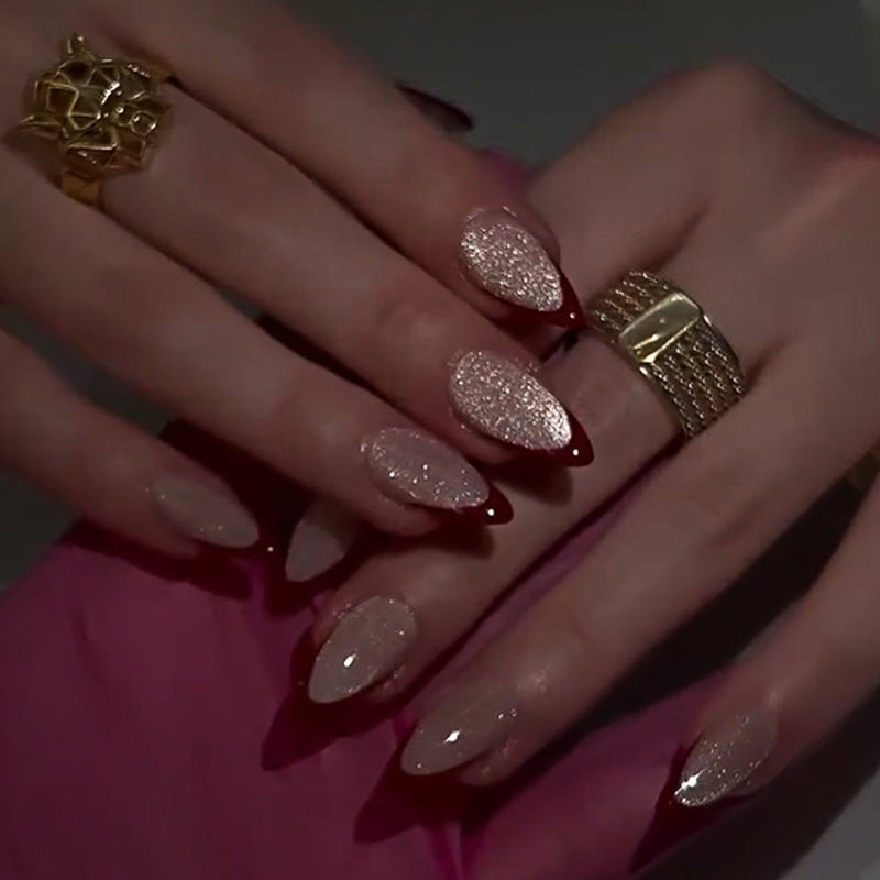 Artificial stiletto nails with sparkling tips Stornfield