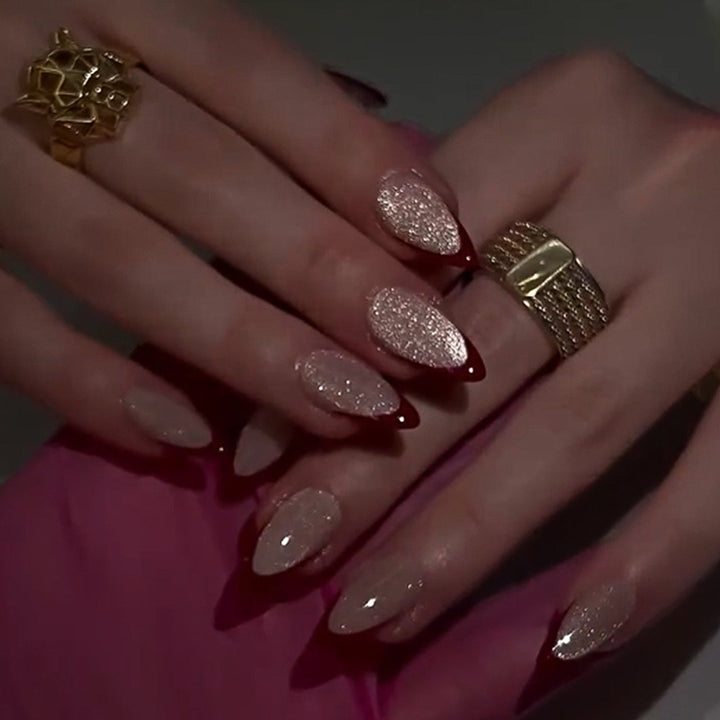 Artificial stiletto nails with sparkling tips Stornfield