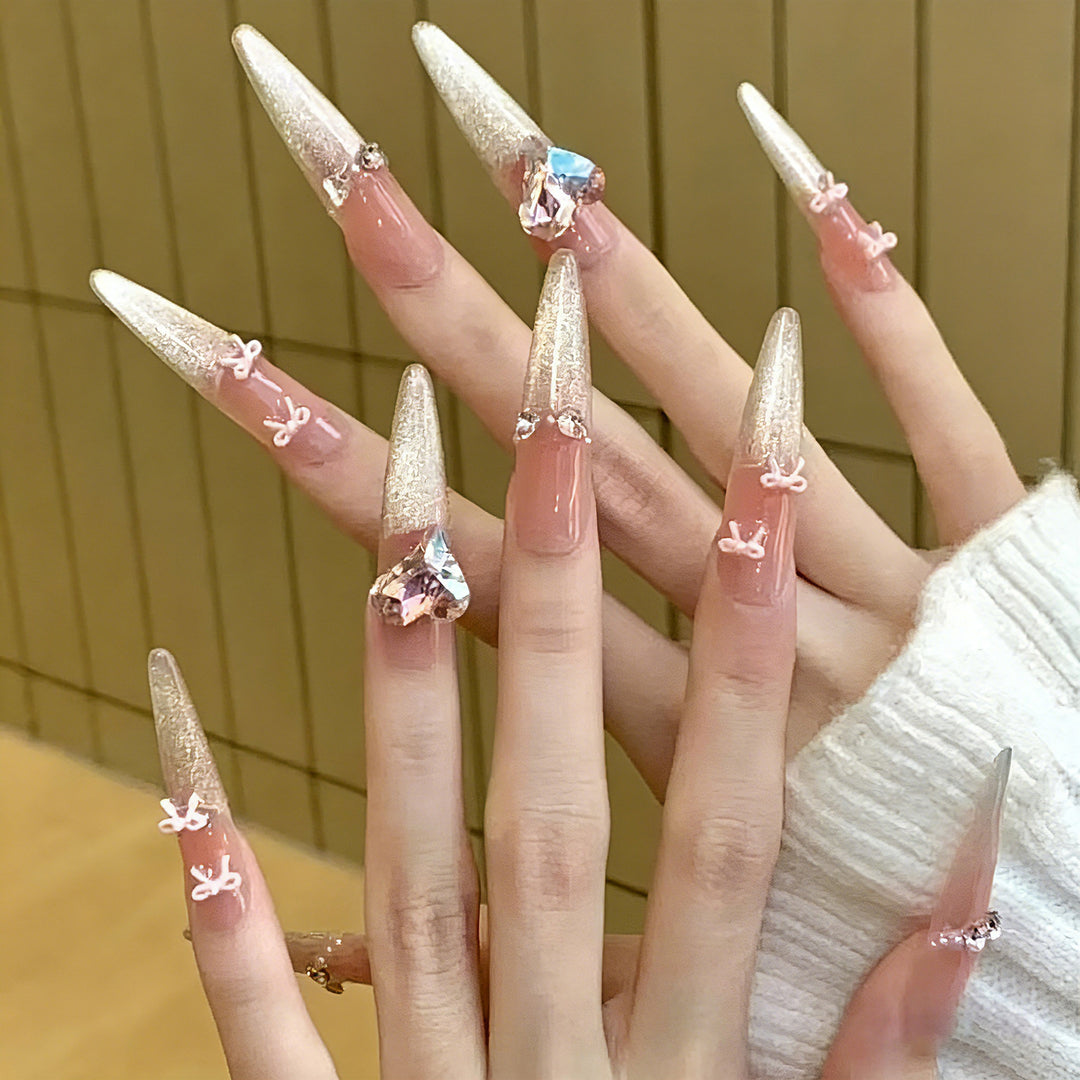 Art nail set with sparkling tips and delicate bow decorations Stornfield