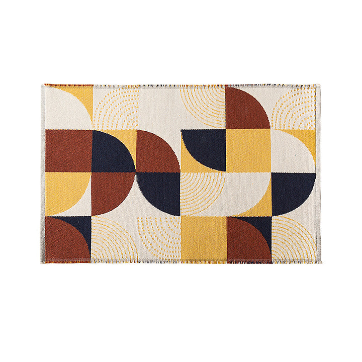 Flat-woven living room rug in a graphic tile pattern
