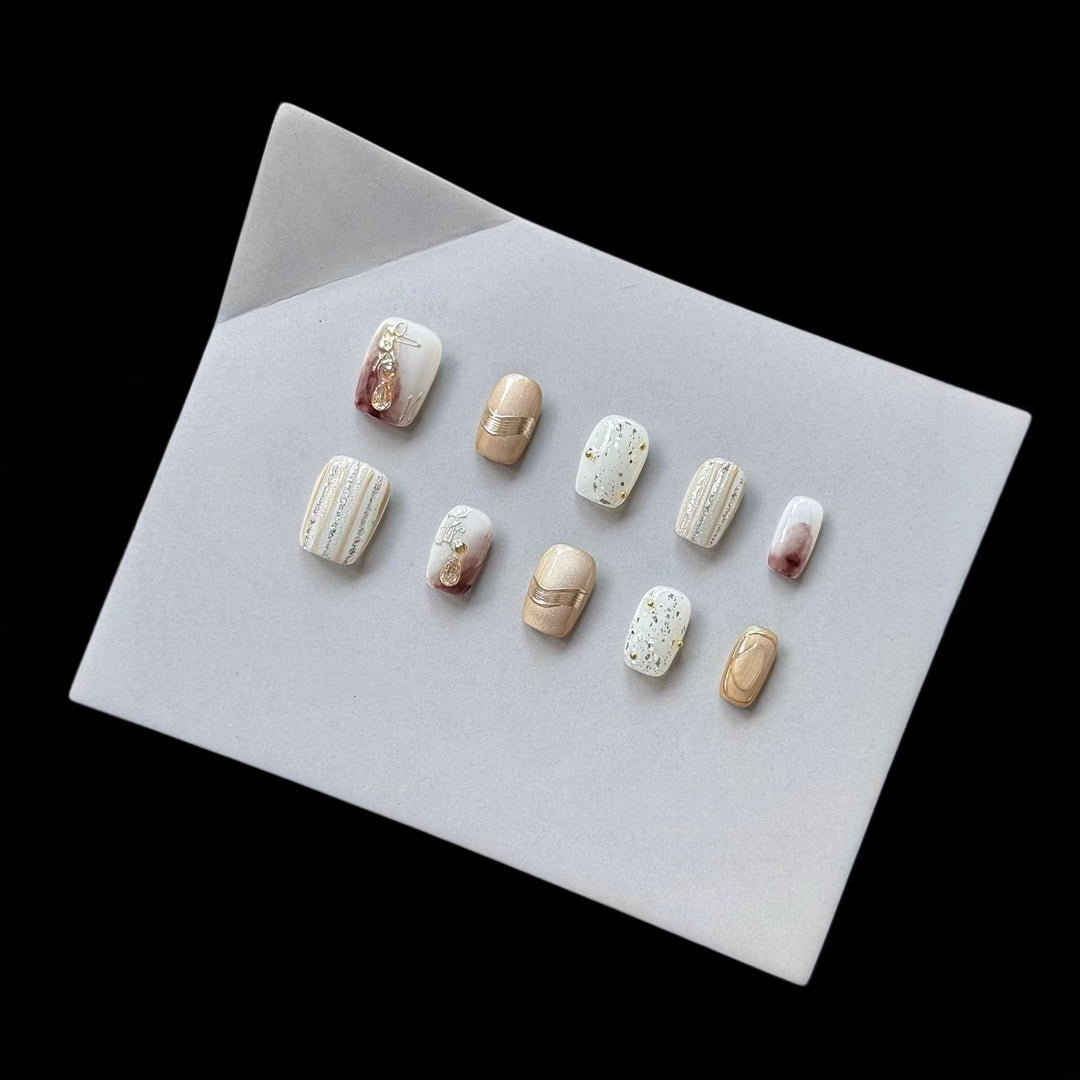 Elegant Decorative Press-On Nail Set with Gold and Marble Accents