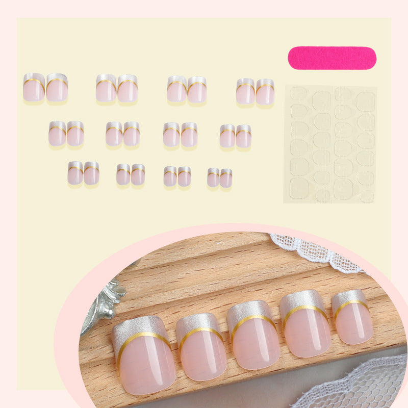 Artificial nail creations with elegant gold trim Stornfield