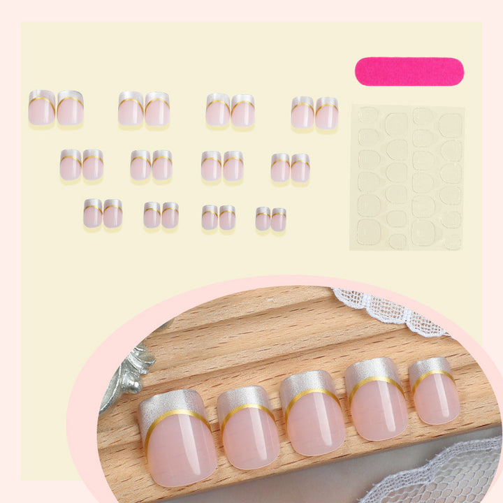 Artificial nail creations with elegant gold trim Stornfield