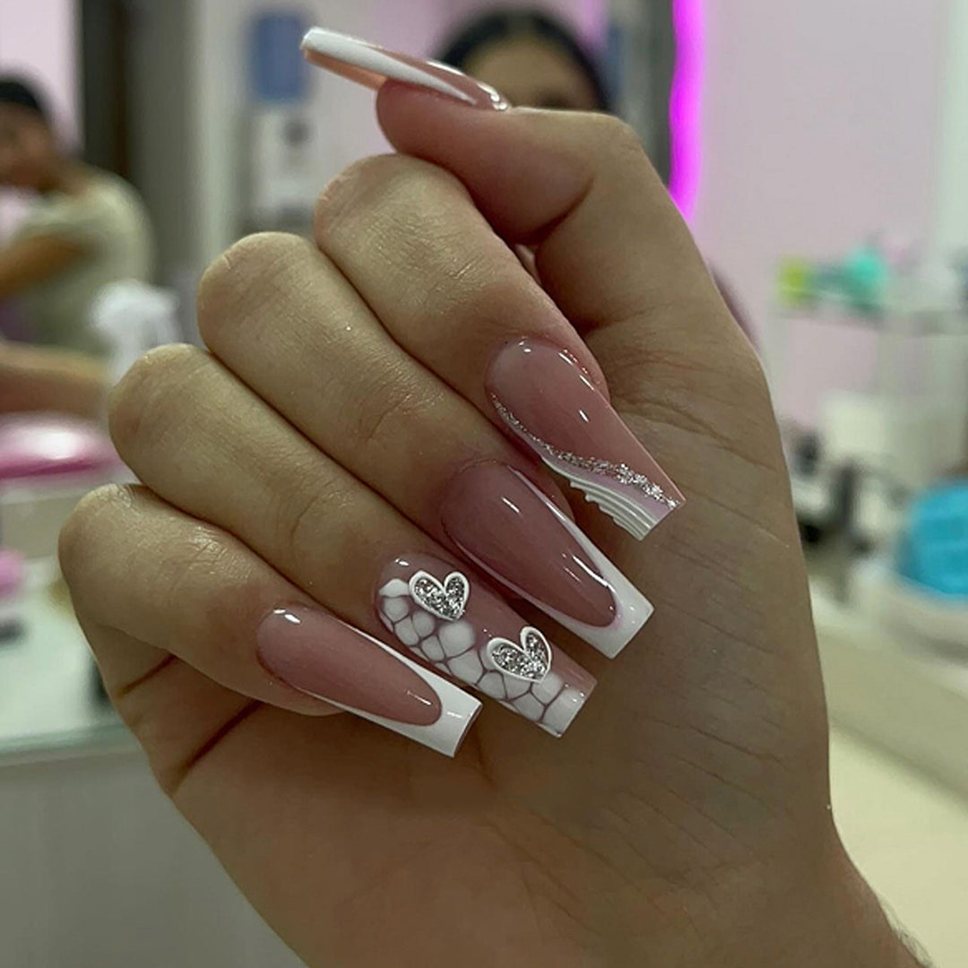 Artful Nail Extensions with Heart Design and Glitter Accents Stornfield