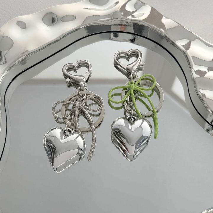 Heart-Shaped Metallic Keychain with Decorative Bow Stornfield