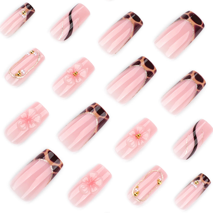 Artificial nail art with flower and glitter effects Stornfield