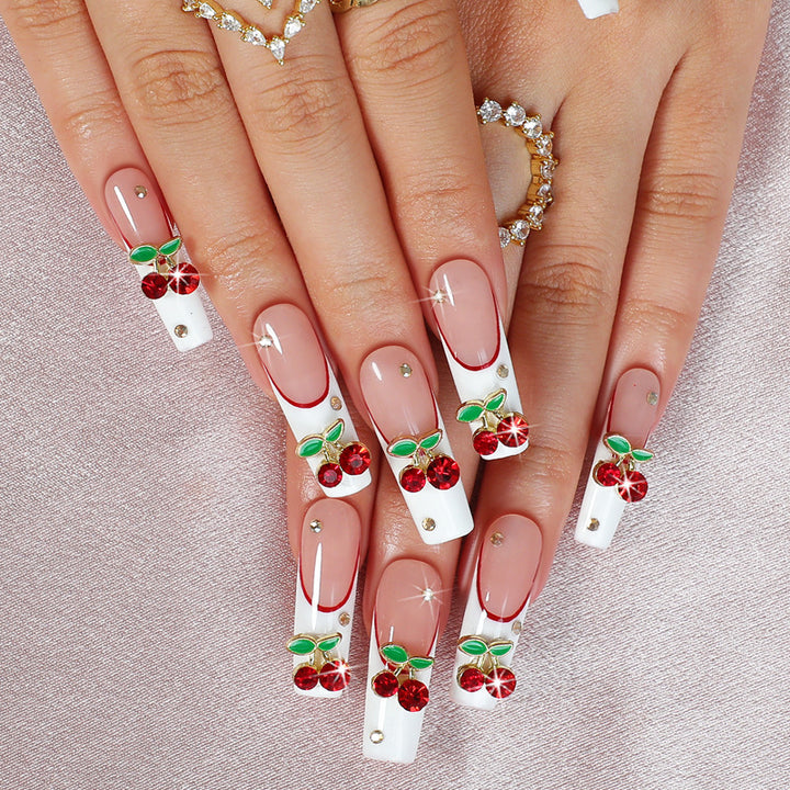 Artificial nail set with cherry motif and sparkling rhinestones Stornfield