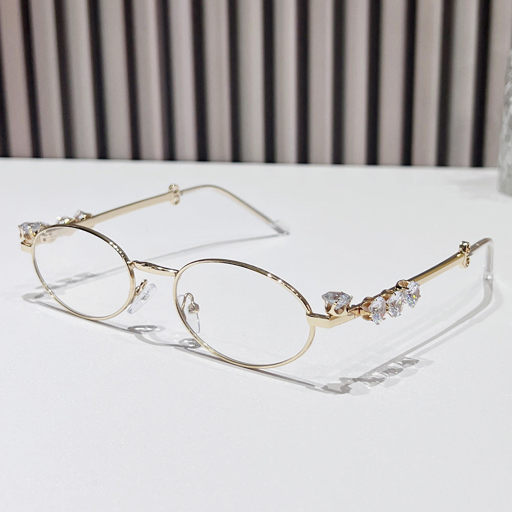 Fashion-Forward Oval Sunglasses with Crystal Accents Stornfield
