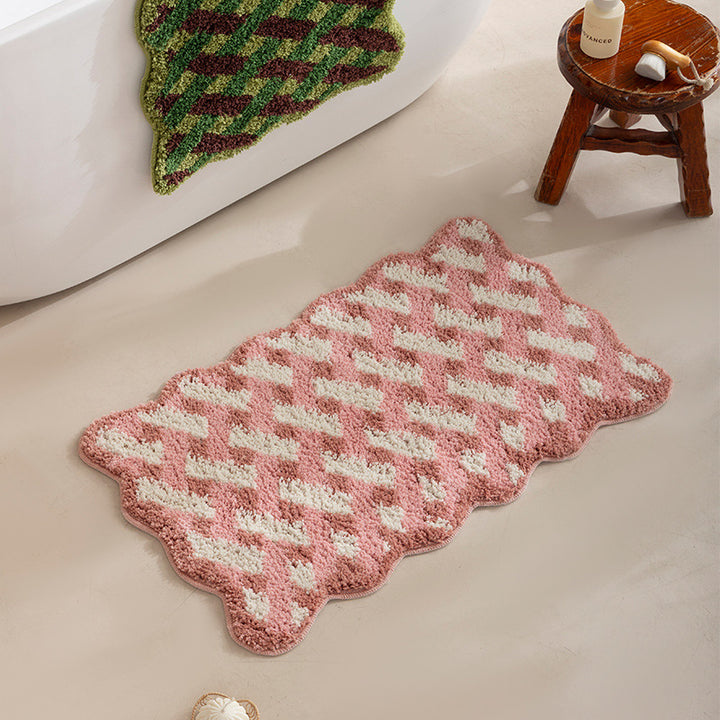 Tufted bathroom runner with wavy hem and relief-style braided pattern Stornfield