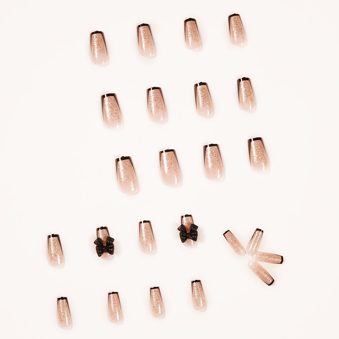 Artistic Nail Extensions with Glitter and Bow Accents Stornfield