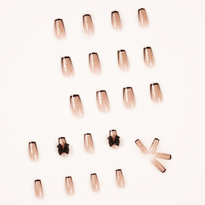 Artistic Nail Extensions with Glitter and Bow Accents Stornfield
