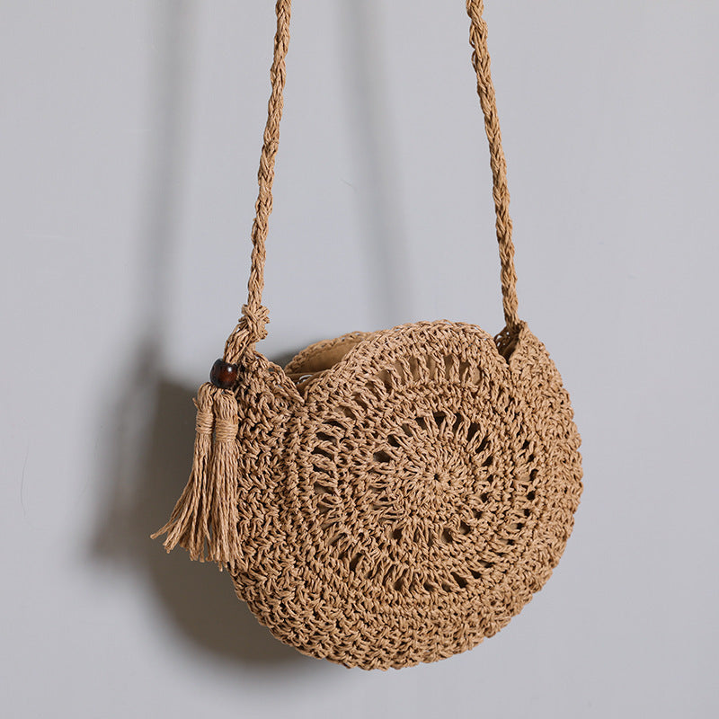 Round bag made of natural jute material with trendy fringe detail Stornfield