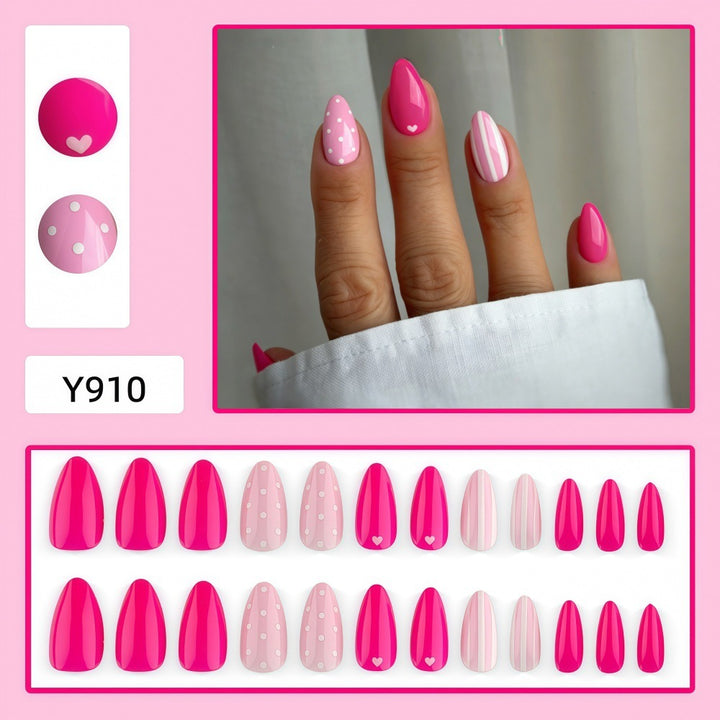 Artificial nails in playful design with hearts and dots Stornfield