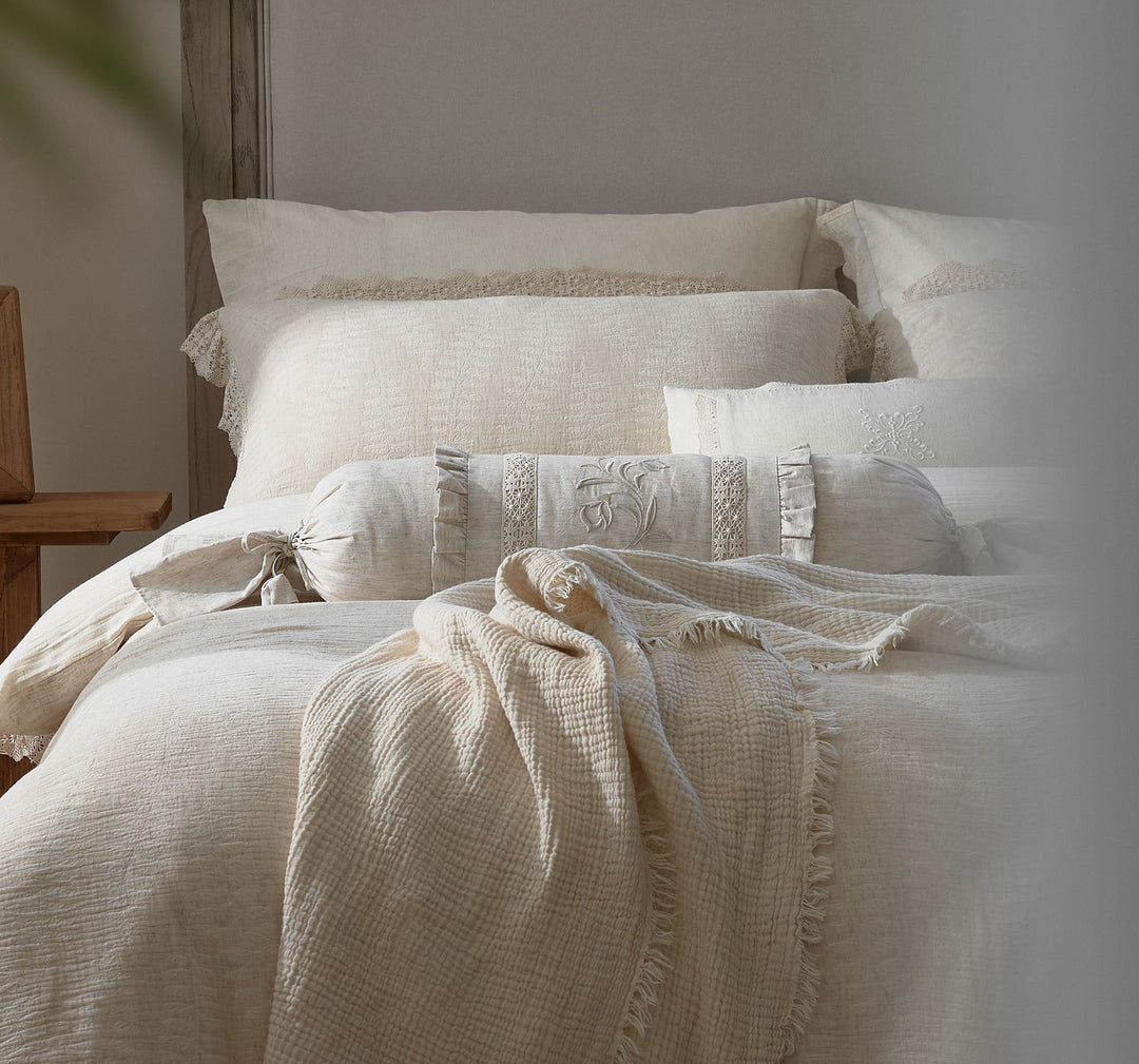 Natural linen bedding set with lace edge and decorative neck roll
