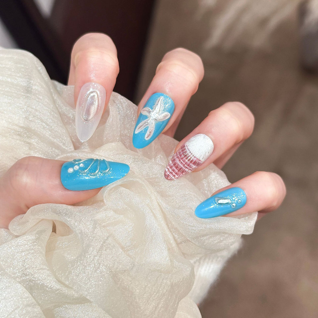 Artistic Press-On Nail Set with Ocean-Themed Designs