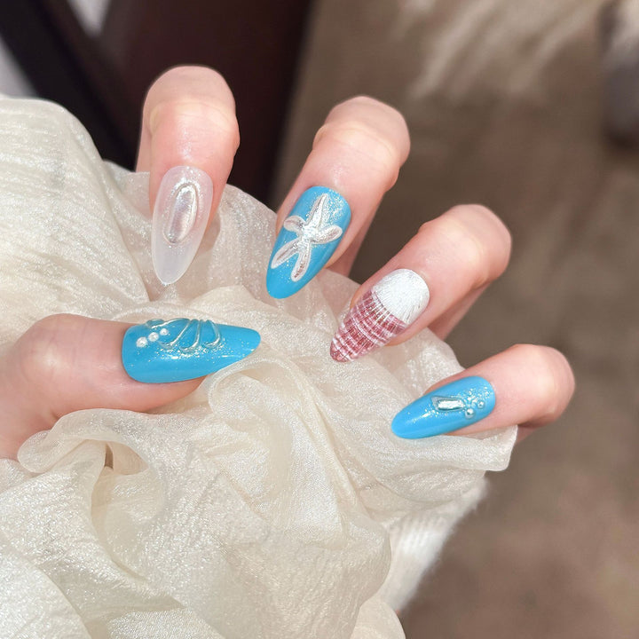Artistic Press-On Nail Set with Ocean-Themed Designs