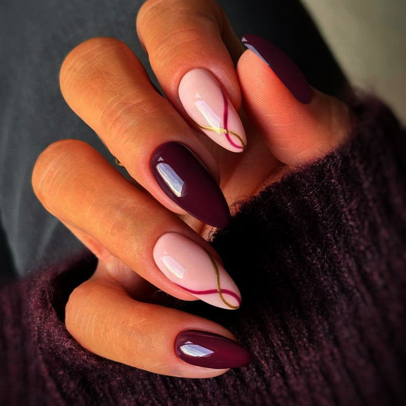 Artistic Almond-Shaped Press-On Nails with Elegant Gold Detailing Stornfield