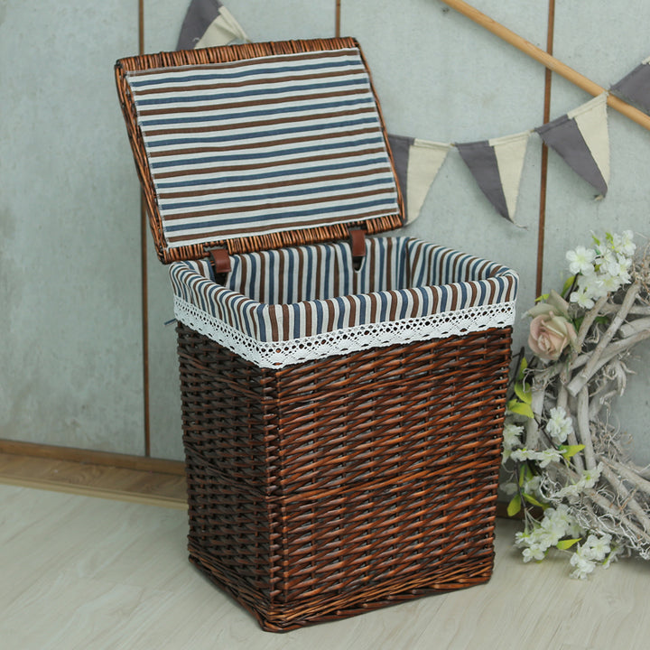Women's laundry basket with elegant fabric cover and decorative elements Stornfield