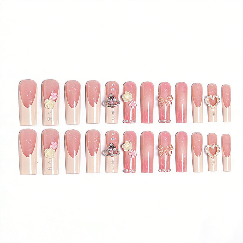 Artful nail tips with pearl and bow motifs Stornfield