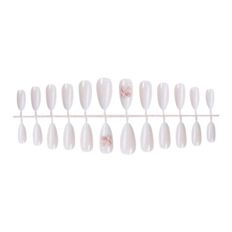 Elegant artificial nail set with luxurious ombre effect and delicate bow accents Stornfield