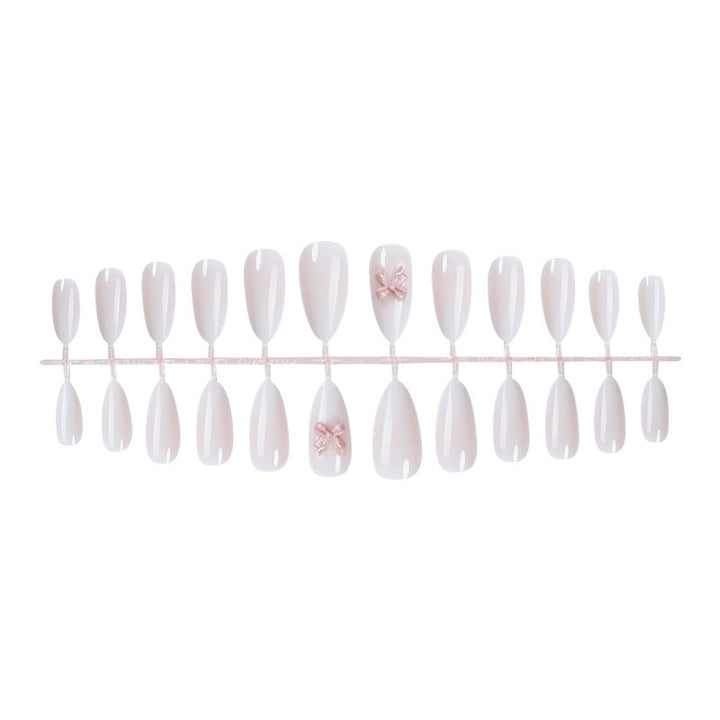 Elegant artificial nail set with luxurious ombre effect and delicate bow accents Stornfield