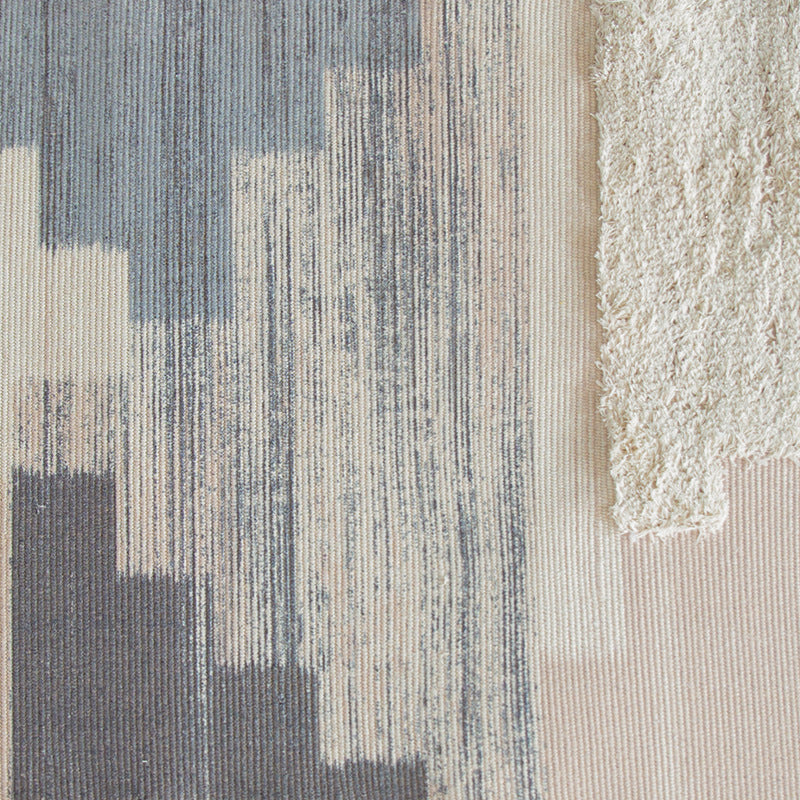 Modern woven living room rug with abstract structure and tufted high-pile accents Stornfield