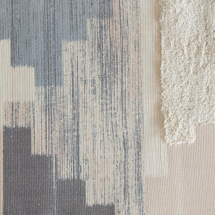 Modern woven living room rug with abstract structure and tufted high-pile accents Stornfield