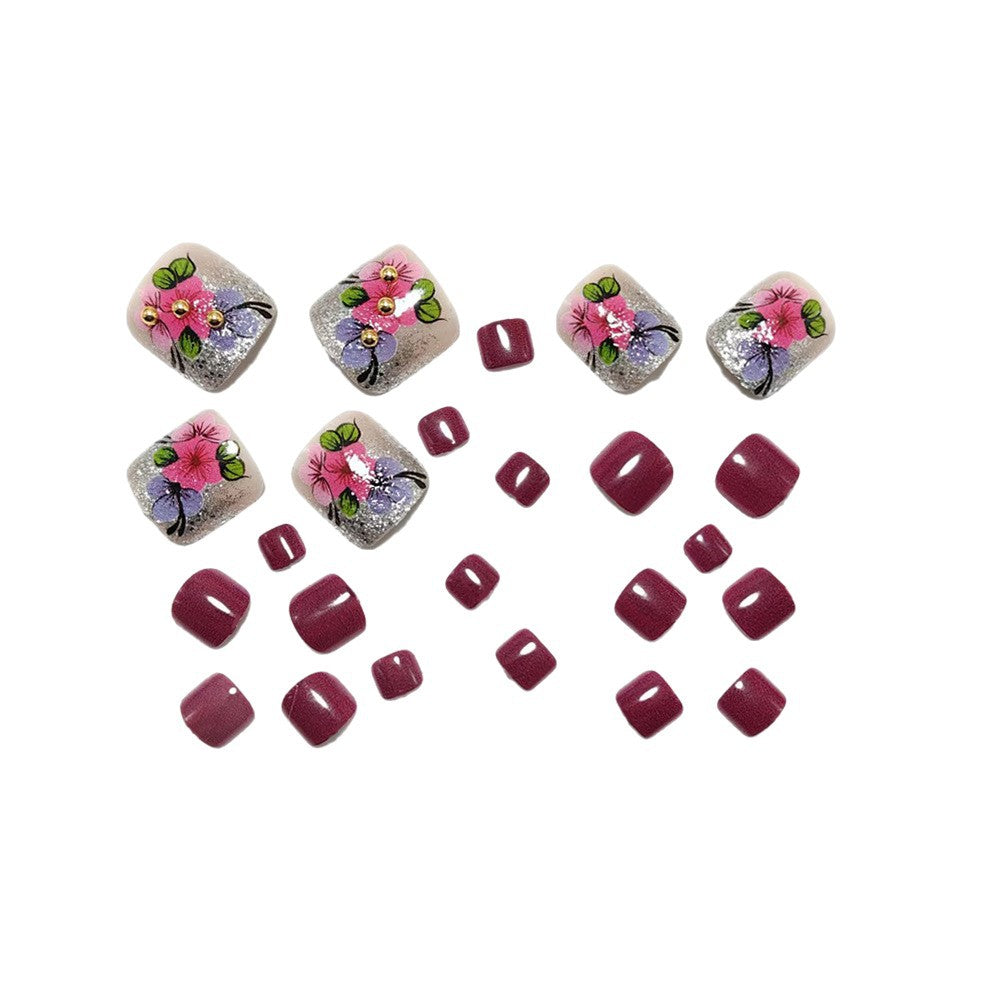 Artificial nails with floral designs and glitter effects Stornfield