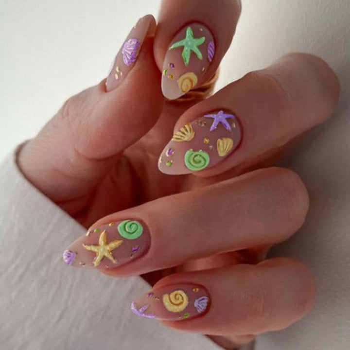 Artistic Press-On Nail Design with Ocean-Inspired Accents Stornfield