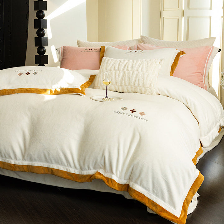 Velvety duvet cover set with embroidered floral design and contrasting piping