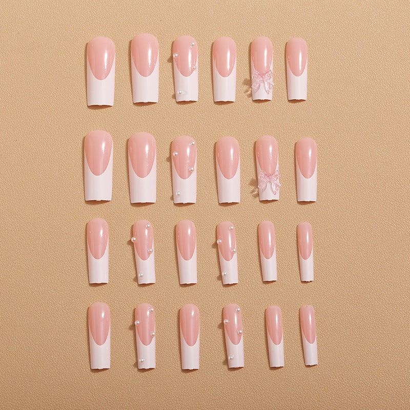 Artistic nail extensions with pearls and bows decorations Stornfield