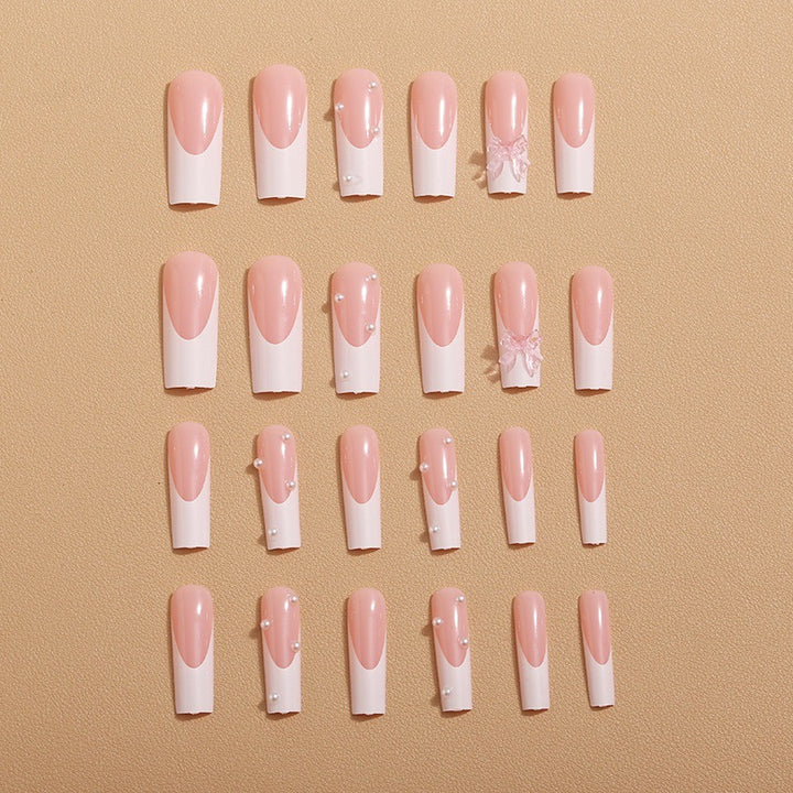 Artistic nail extensions with pearls and bows decorations Stornfield