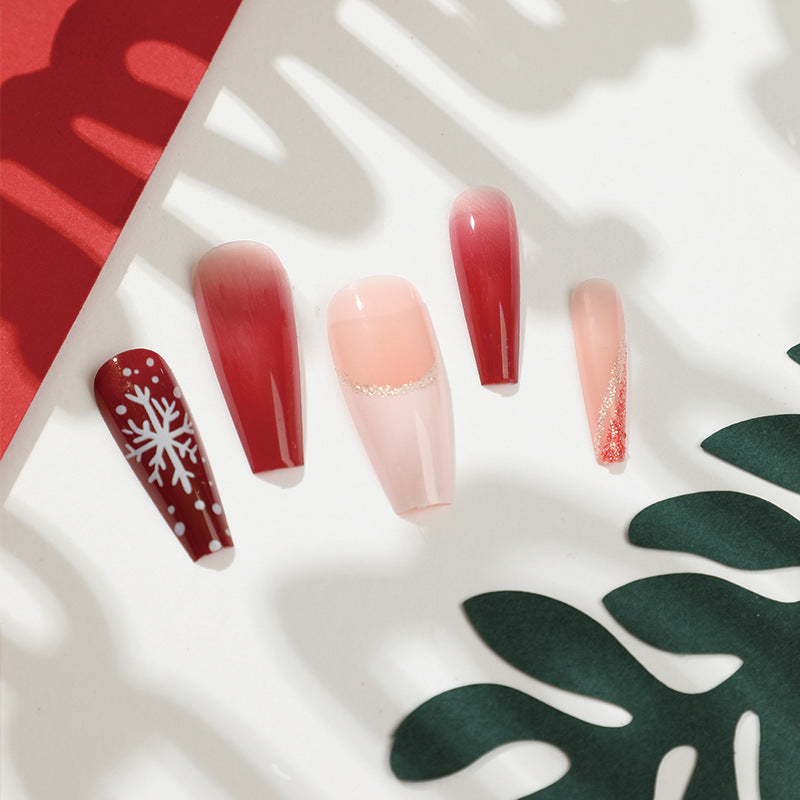 Artful Christmas nail extensions with elegant glitter and snowflake design Stornfield