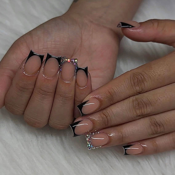 Artificial nail set with elegant black tips and sparkling accents Stornfield