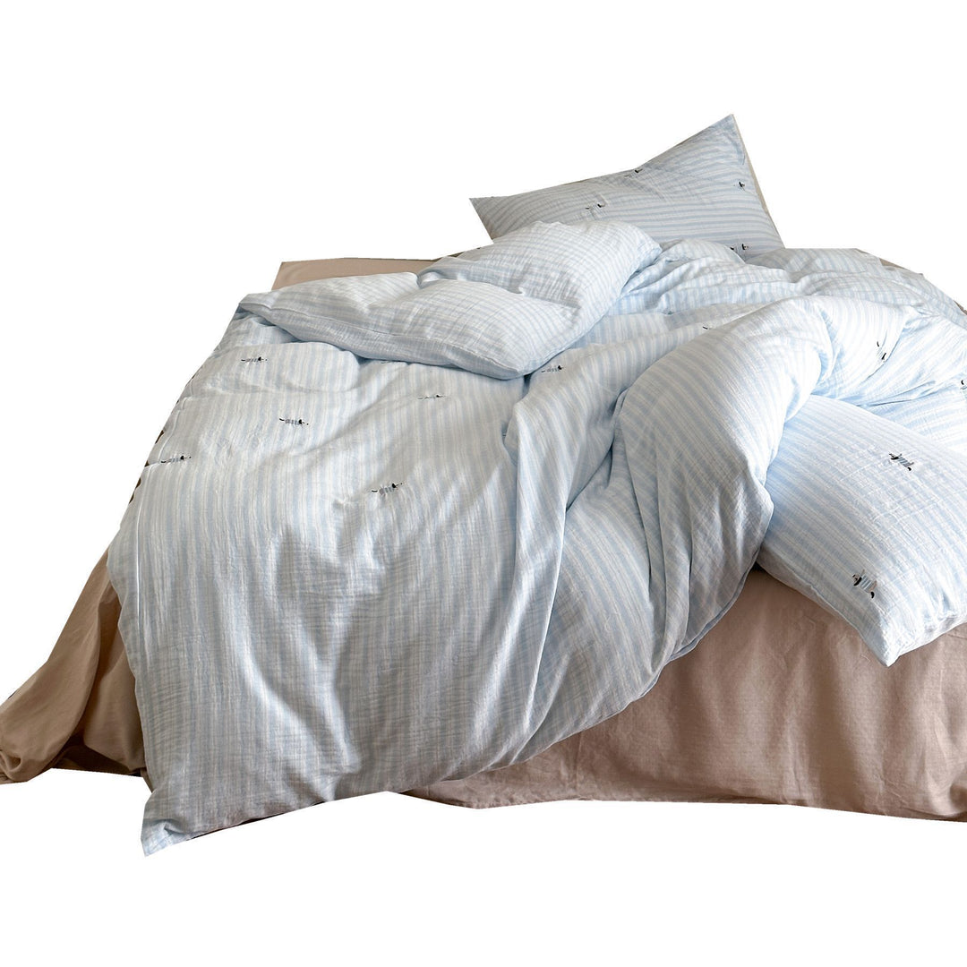 Cotton duvet cover set with fine pinstripes and subtle embroidery applications