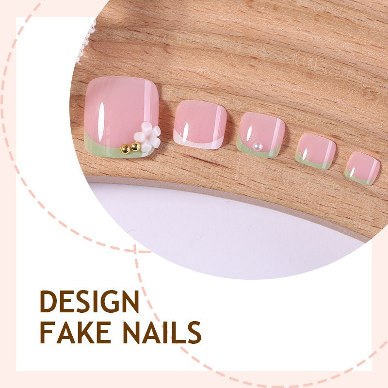 Nail art set with delicate flower designs and glossy finish Stornfield