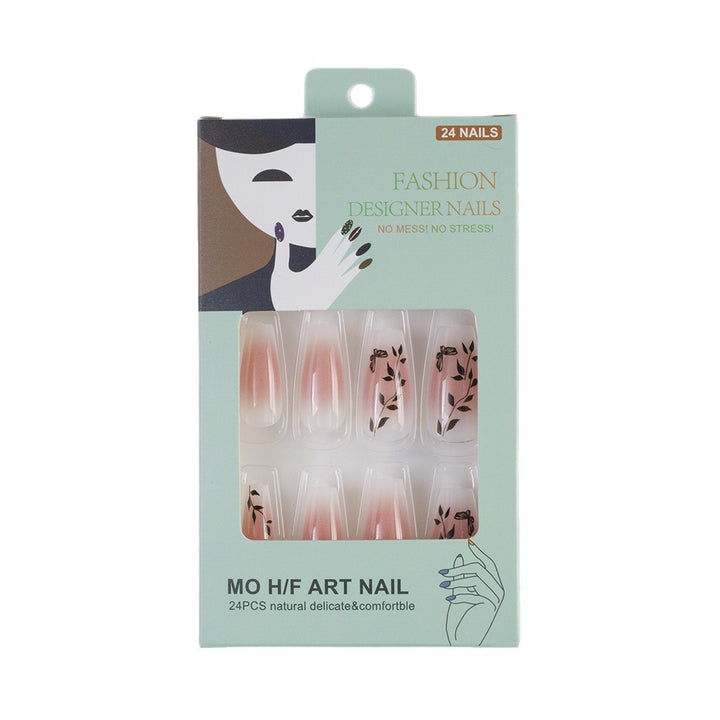 Press-on nails in elegant ombre design with floral accents Stornfield