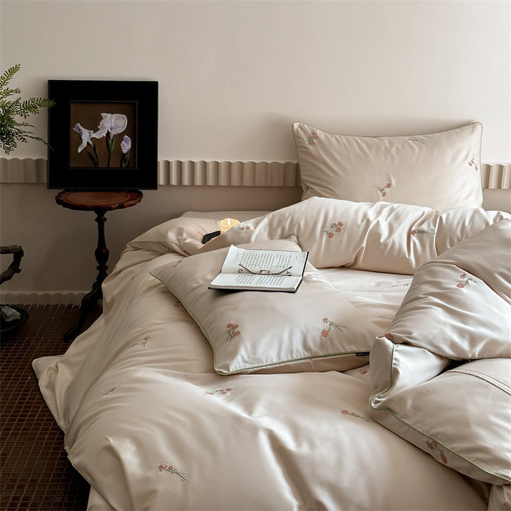 Luxurious cotton satin bedding set with delicate floral embroidery and a silky-matte surface