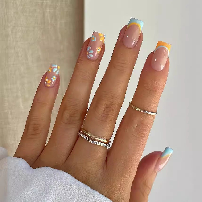Nail art set with creative floral designs and elegant French finish Stornfield