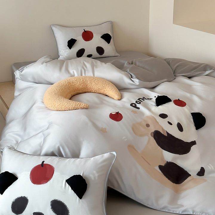 Children's bedding made of silk-matte satin with illustrative panda and apple print as well as fine piping