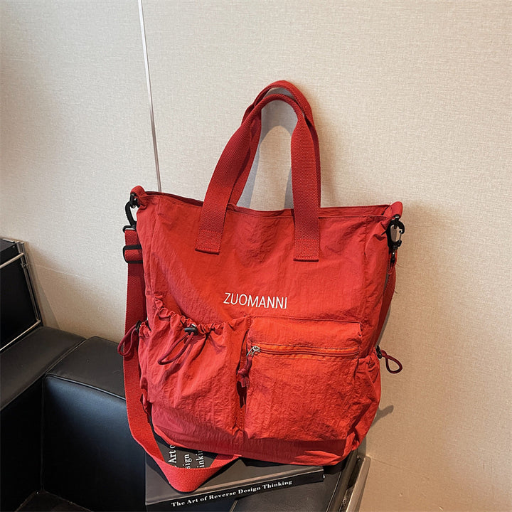 Tote bag with multifunctional outer pockets and adjustable shoulder strap Stornfield