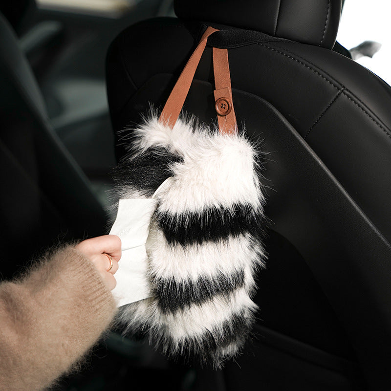 Handy tissue storage made of faux fur with leather handle and pompom