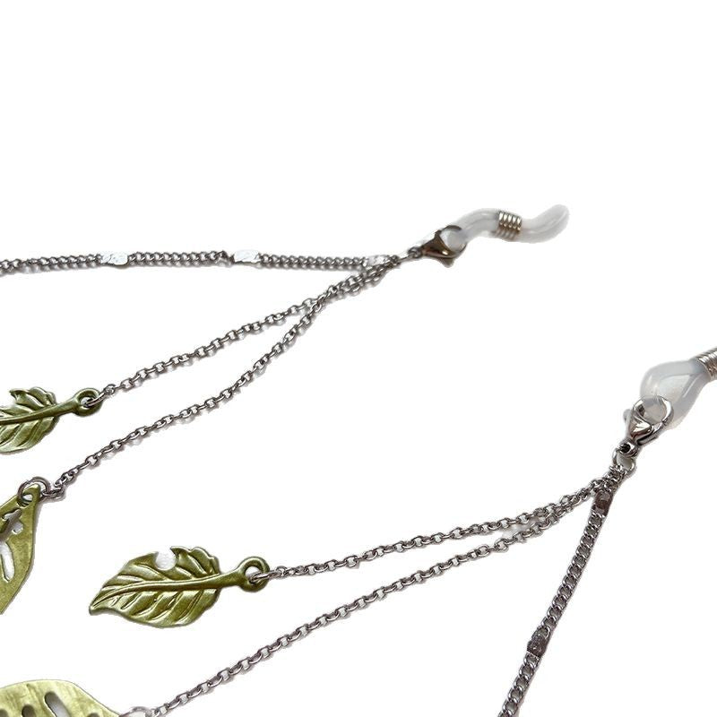 Fashionable glasses holder chain with leaf motifs Stornfield