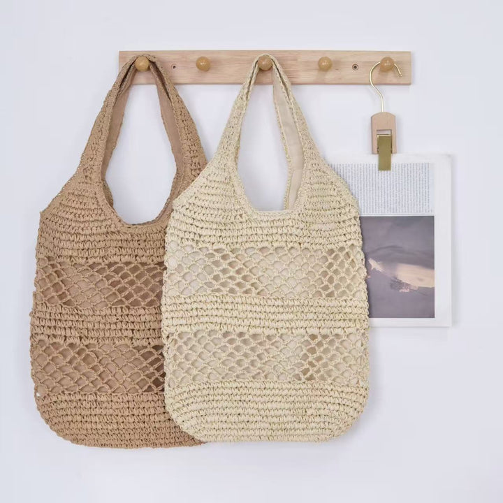 Handbag made of braided natural material with tassel details Stornfield